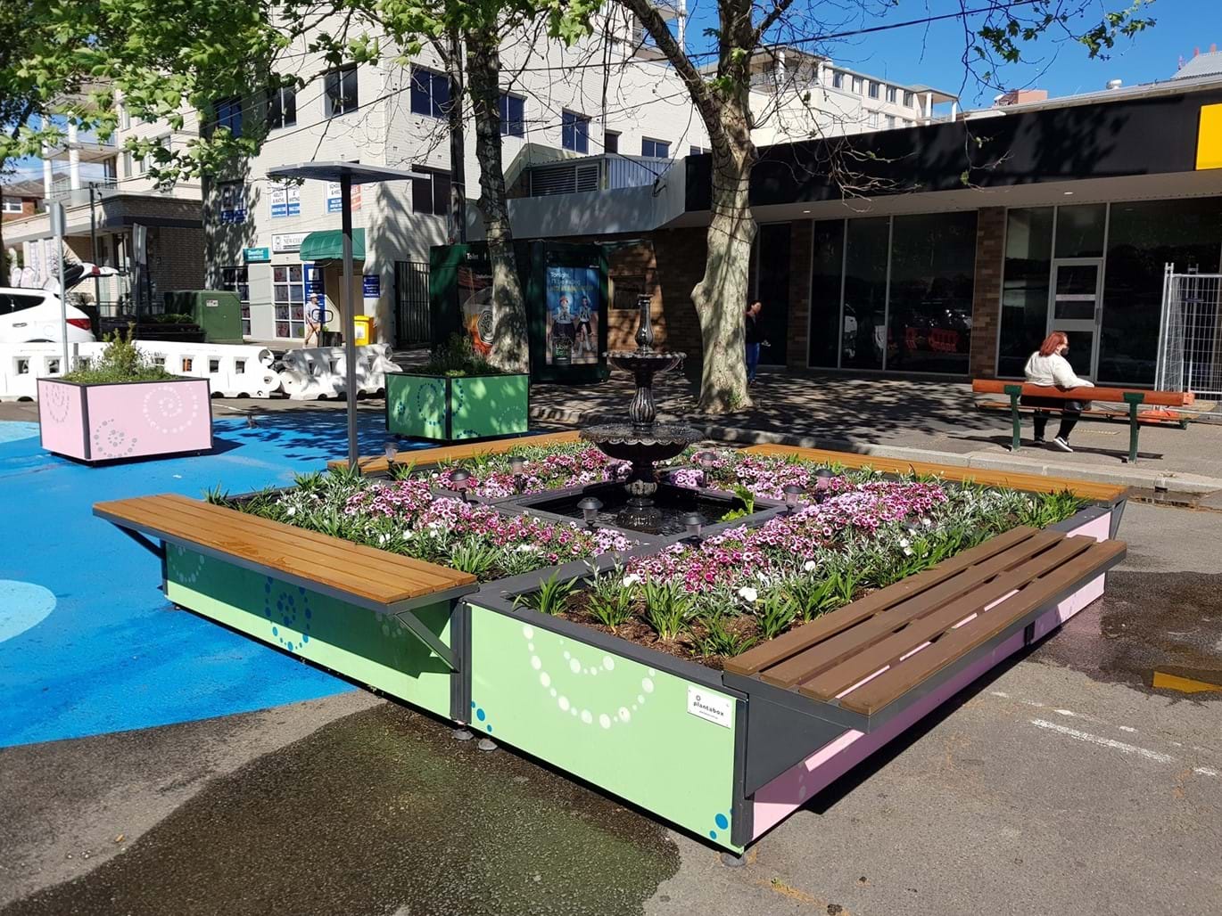 Water feature built around Small Plantabox planters and seating